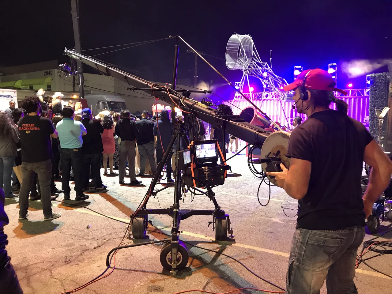Ariel Roncoli operating a camera crane during a live production